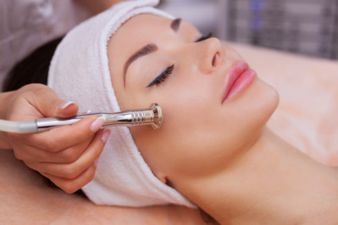 the-doctor-cosmetologist-makes-the-procedure-microdermabrasion-of-the-facial-skin-of-a-beautiful-young-woman-in-a-beauty-salon-cosmetology-and-professional-skin-care